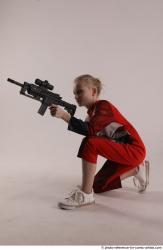 DENISA KNEELING POSE WITH GUN